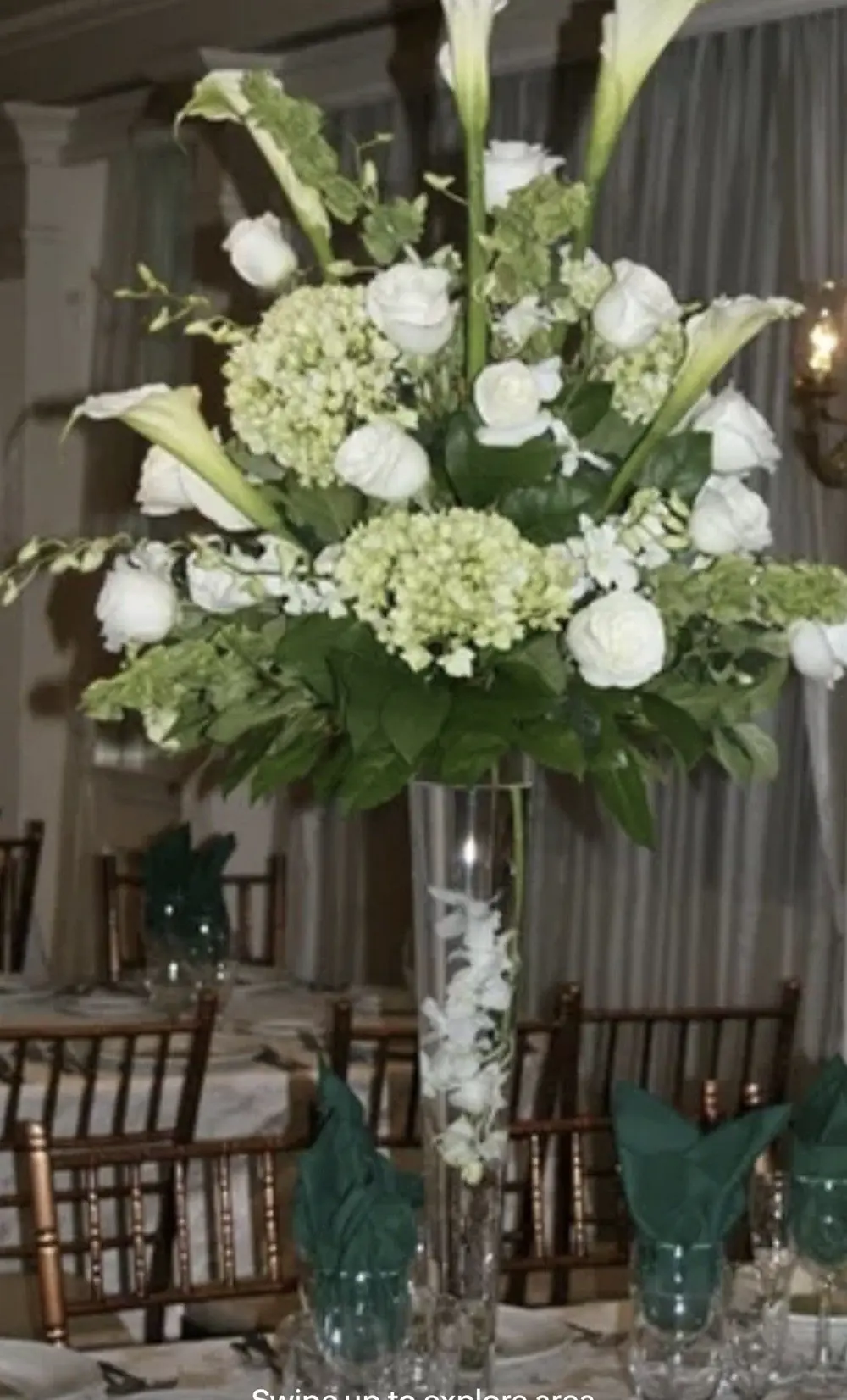 Classic white rose, hydrangea, and calla lily arrangement